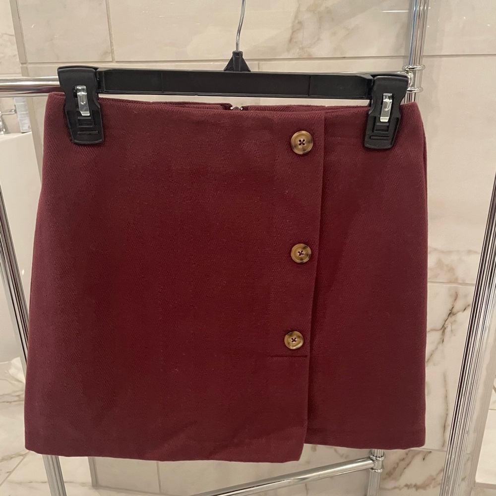 GB Girls side button mini skirt, color port, size 12
Purchased from Dillards.